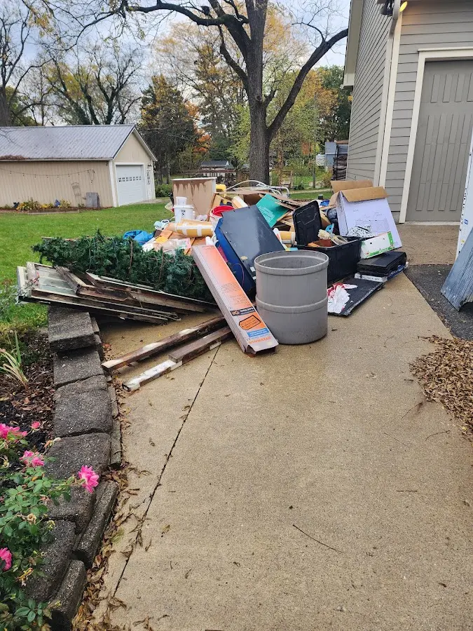 Dumpster being loaded with debris for Residential Dumpster Rental in Vernon